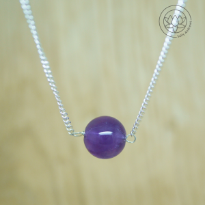 Amethyst single gemstone delicate necklace on a diamond curb chain.