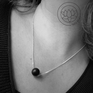 Onyx matt single gemstone delicate necklace on a diamond curb chain.